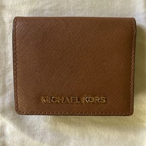 Small Michael Kors wallet with card holders in great shape lightly used.